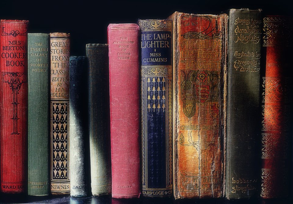 Best historical fiction books stacked in an old library