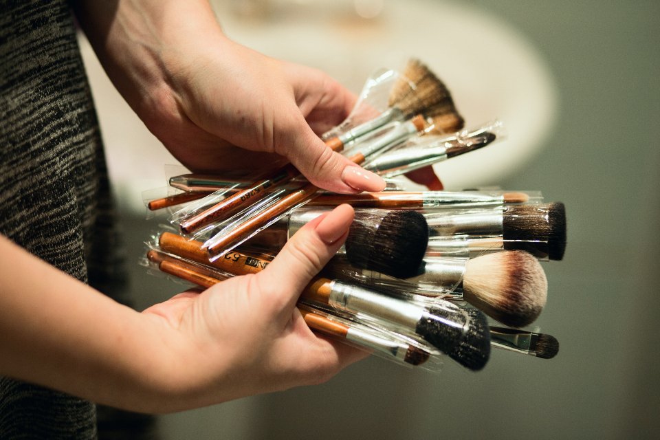 Makeup artist brushes used to apply bronzer