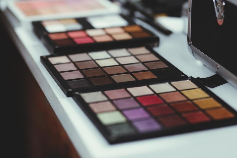 Makeup palettes on a table ready to apply bronzer