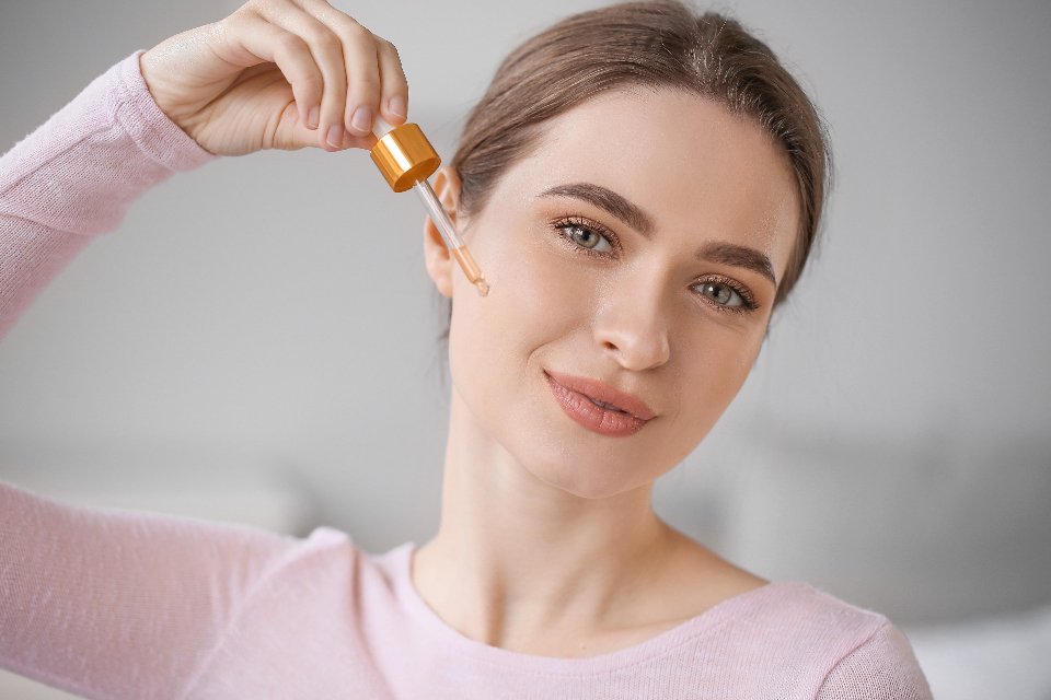 Applying a night serum as part of an evening anti aging routine