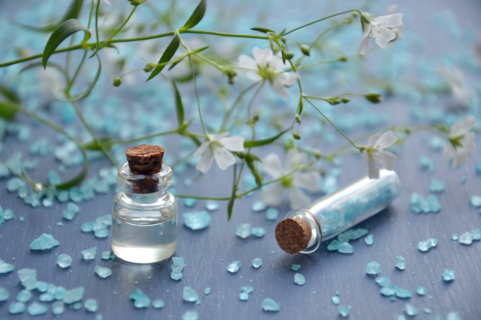Best body oils in a glass bottle with flowers