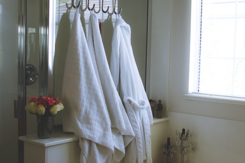 White bathrobe after a hair care routine with leave in conditioner
