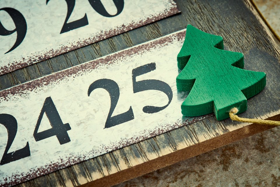 Beauty advent calendars countdown with festive numbers and a felt Christmas tree