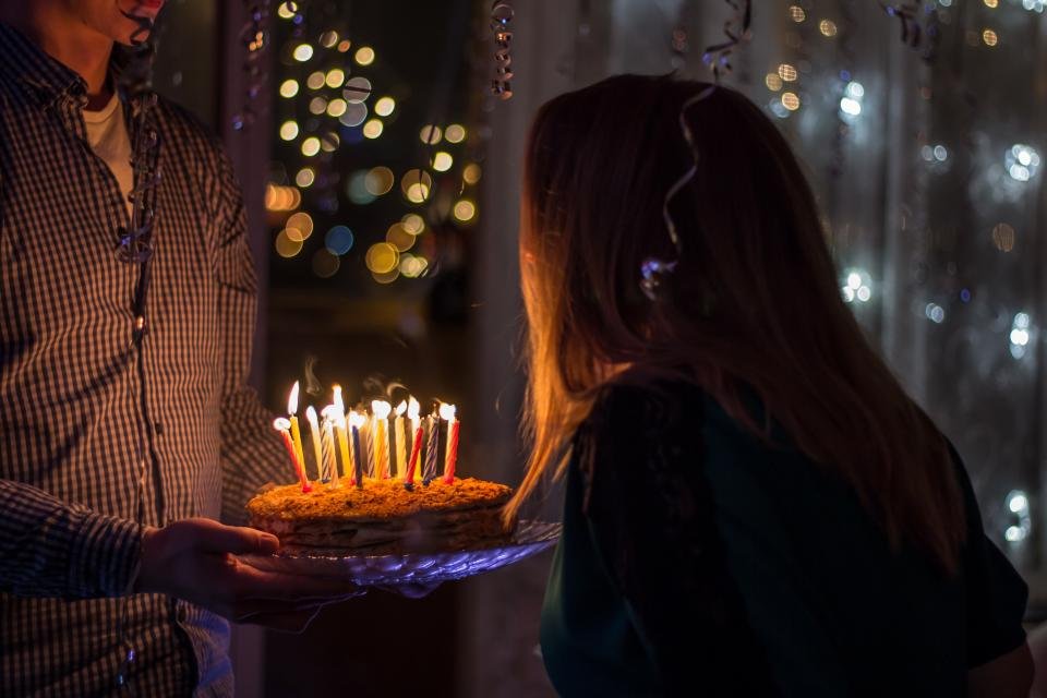 Birthday cake with candles to celebrate mom