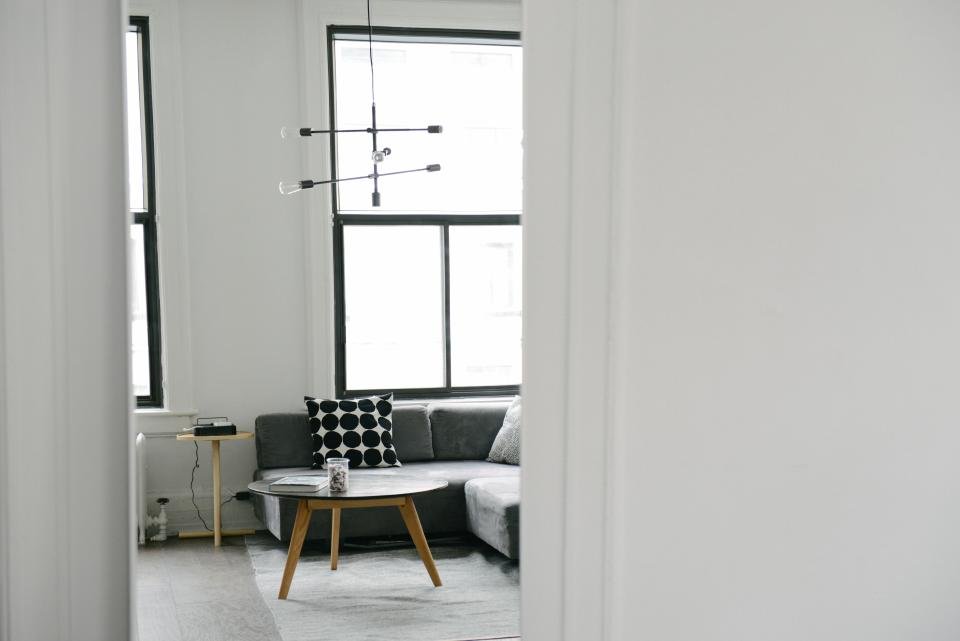 Bright living room with sofa and coffee table, a good spot for home fragrance