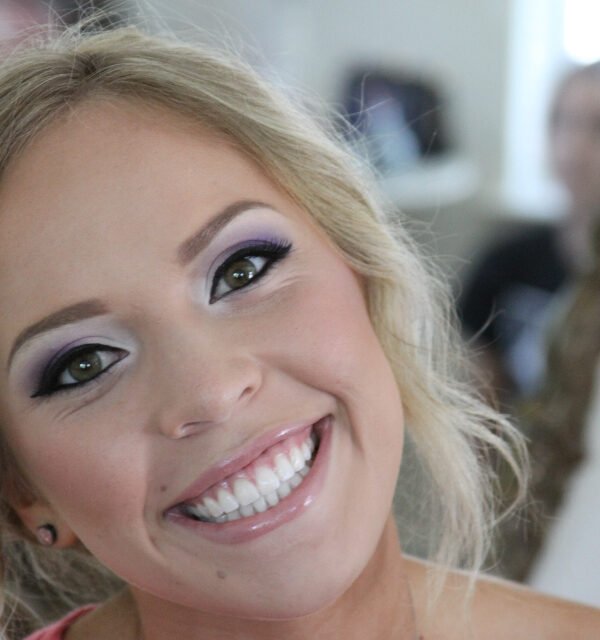 Bright makeup look smiling woman