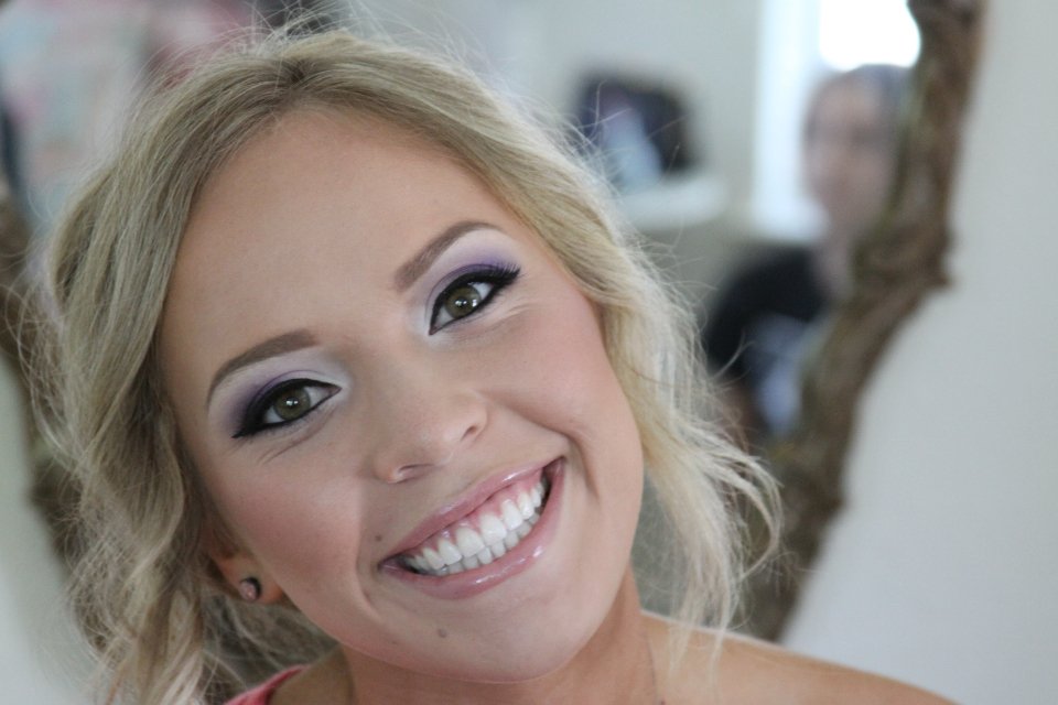 Bright makeup look smiling woman