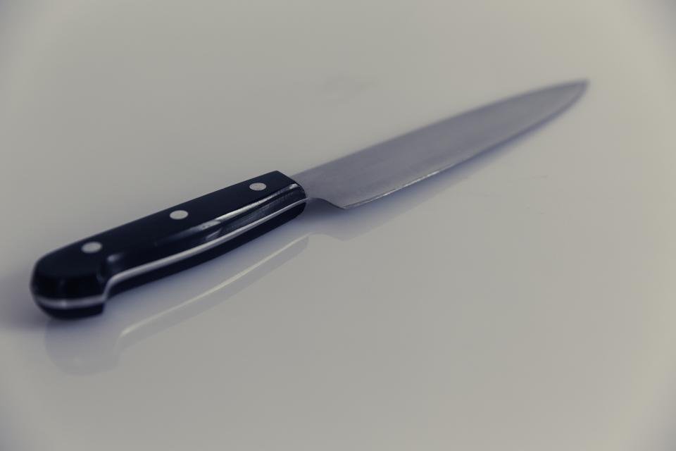 Chef knife on gray