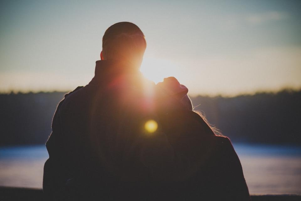 Couple backlit sunset