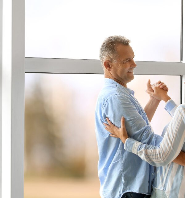 Couple dancing at home