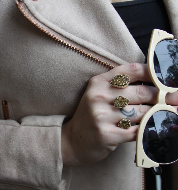 Designer sunglasses in hand