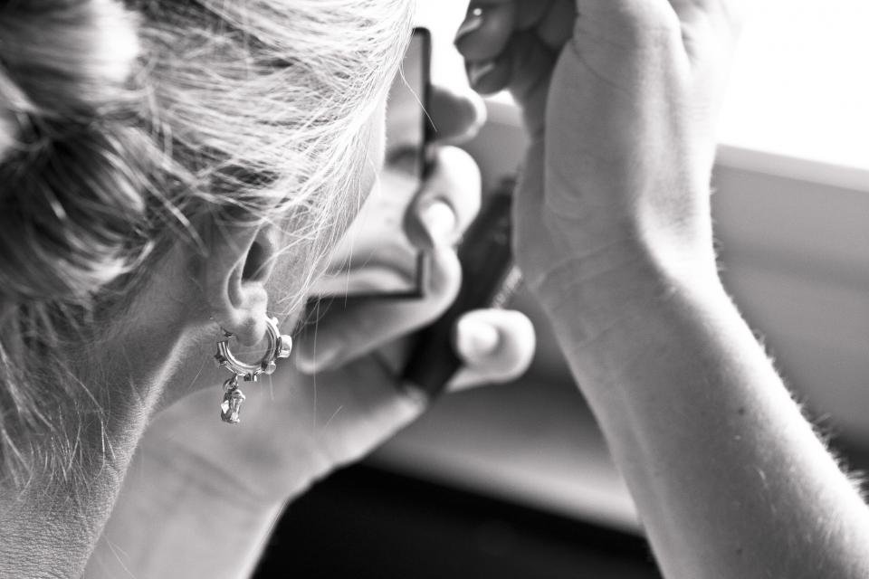 Black and white portrait of a woman wearing earrings