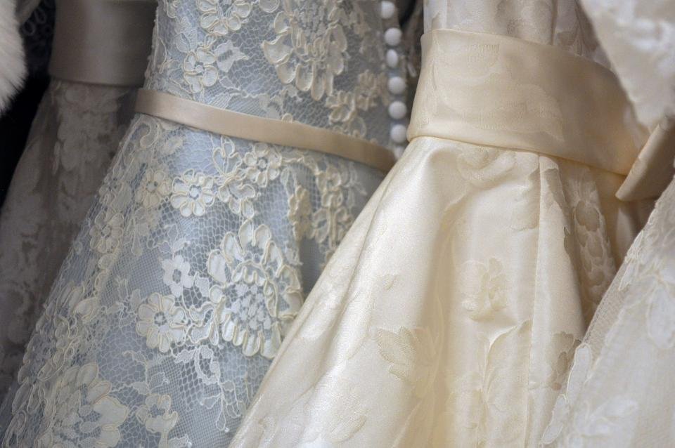 Lace and satin gowns on a rail, inspiration for the best evening gowns