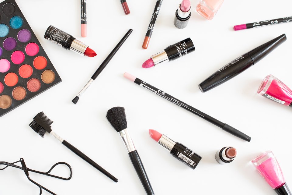 Eyeliner, mascara and makeup products on a white table