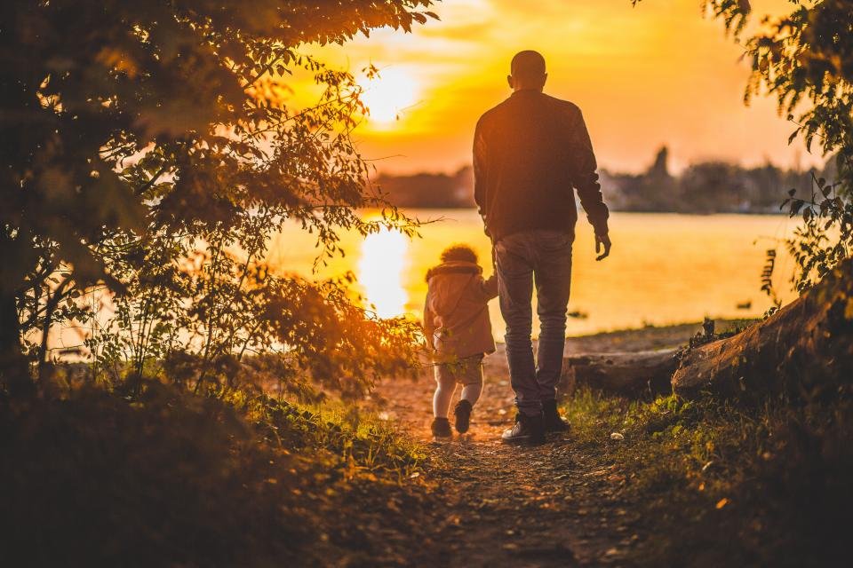 Gifts for dad ideas inspired by a father and child walking at sunset
