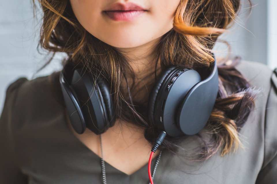 Teen with headphones, showing tech gifts for teen girls