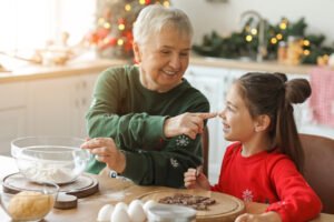 Grandmother baking with granddaughter