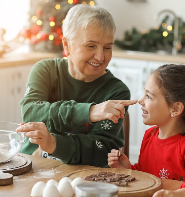 Grandmother baking with granddaughter