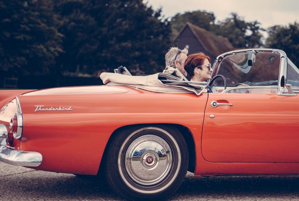 Iconic Hollywood love stories evoked by a vintage red convertible