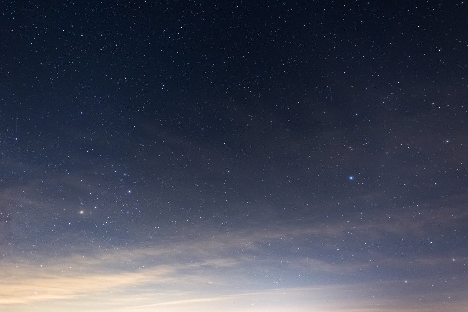 Starry sky fading into a soft blue dawn