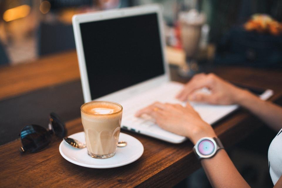 Comparing Amazon deals on a laptop with coffee