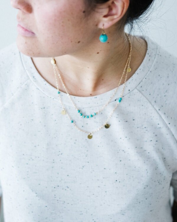 Layered gold necklaces closeup