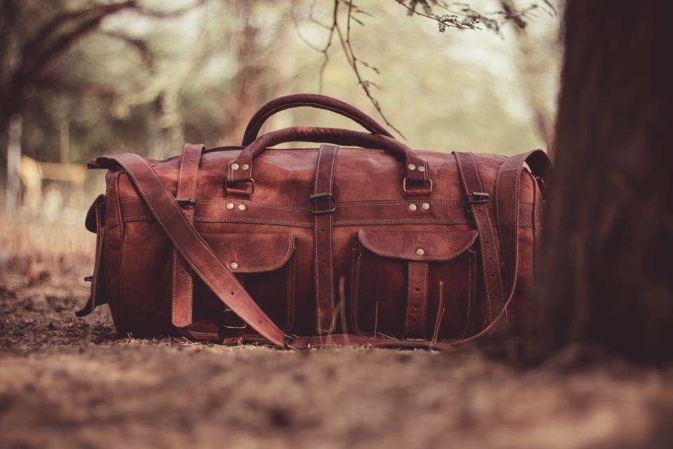 Brown leather bag outdoors – choosing designer crossbody bags
