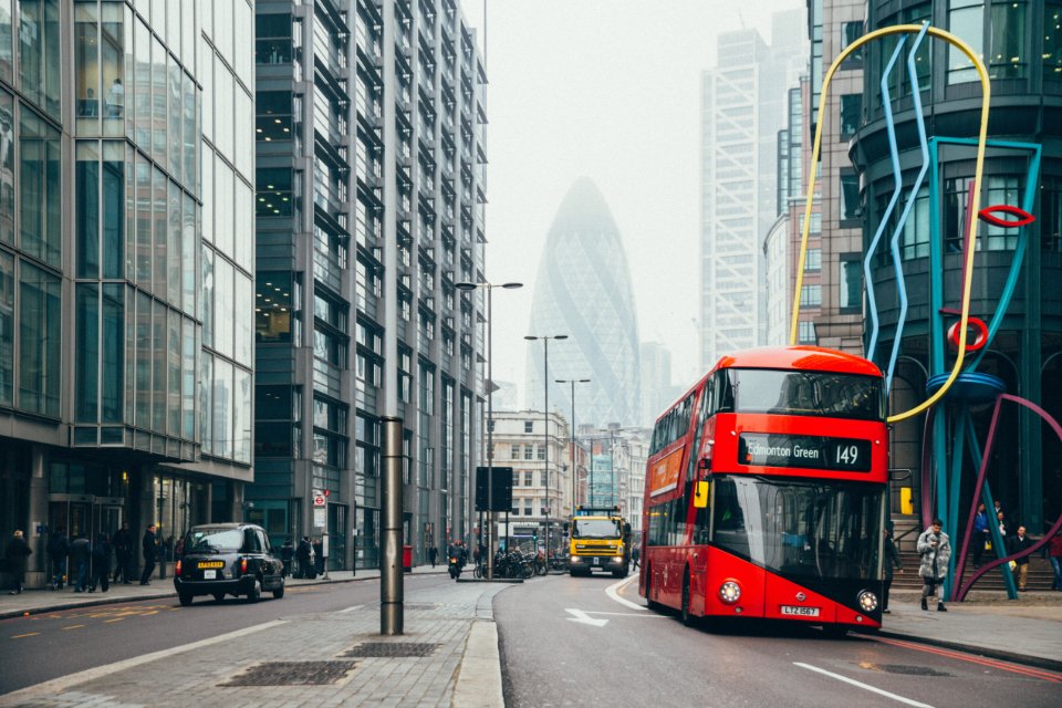 London street with a red bus, home of the London stop in our fashion week guide