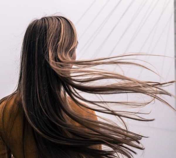 Long dark hair in wind
