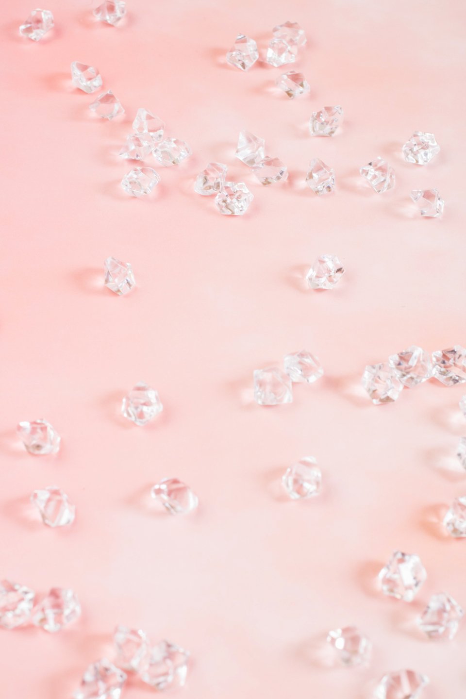 Sparkling stones on a pink background, inspiration for the best diamond stud earrings