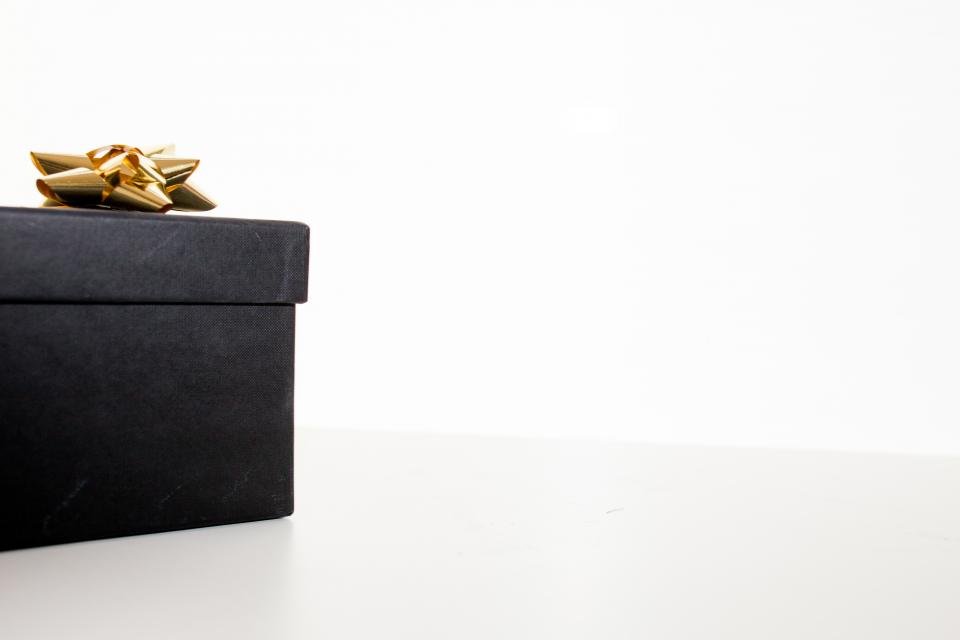 Black gift box with gold bow for luxury gifts for women