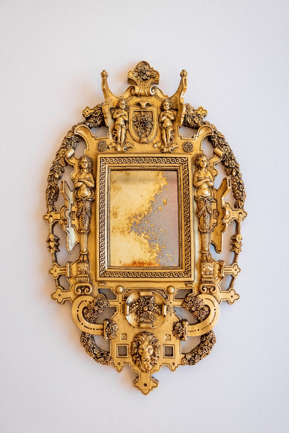 Gold framed mirror inspired by art deco interior design