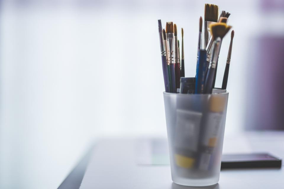 Paint brushes in a glass, honouring the craft of famous women artists