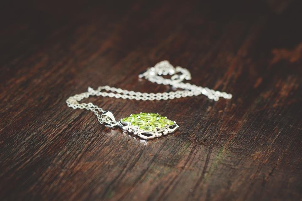 Pendant necklace on a wooden table – jewelry gift ideas