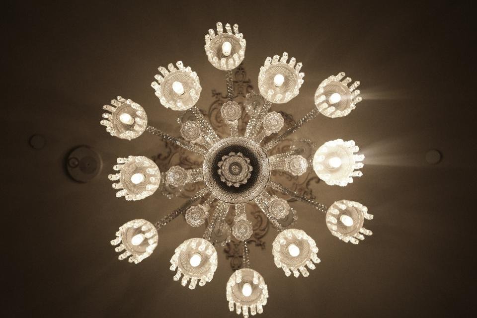Crystal chandelier glowing like a ballroom in the best period drama series