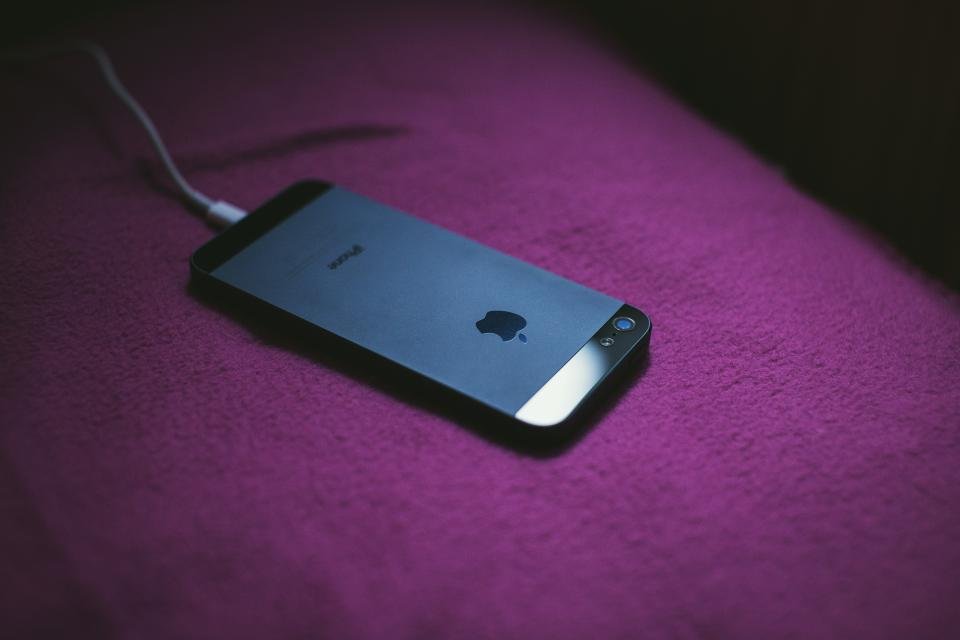 A phone charging from a portable charger cable