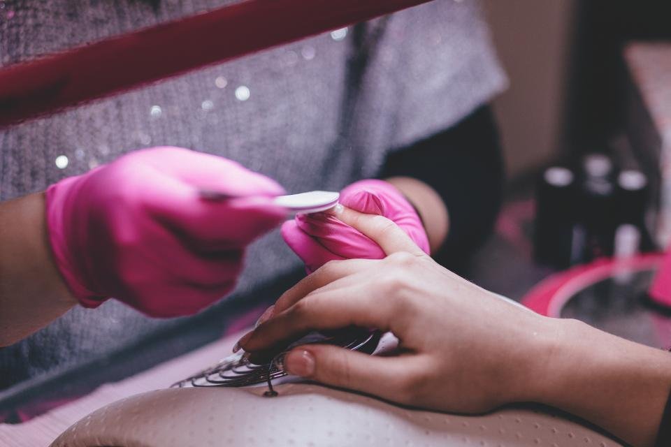 Nail technician working on a manicure