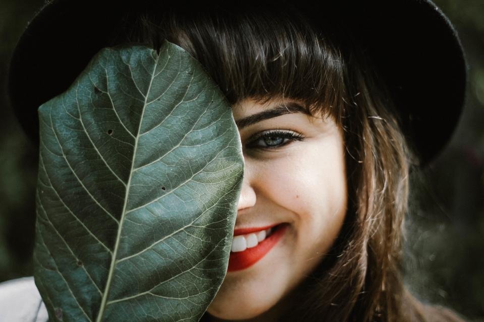 Smiling woman with a red lip from the best luxury lipsticks