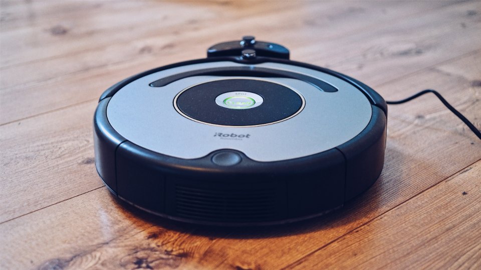 Robot vacuum on a wood floor as an alternative to a stick vacuum