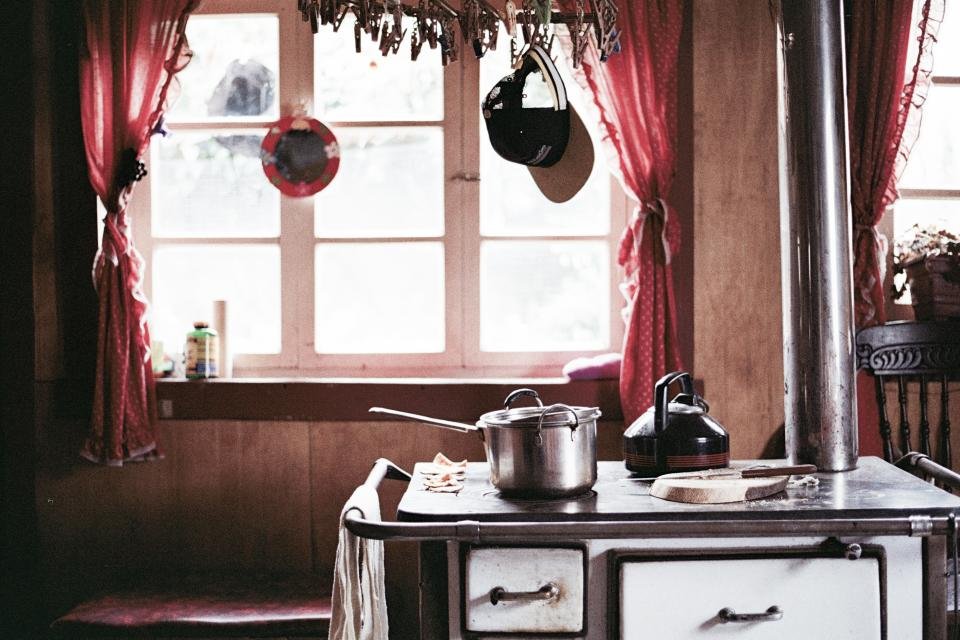 Rustic kitchen with pots and pans on a stove