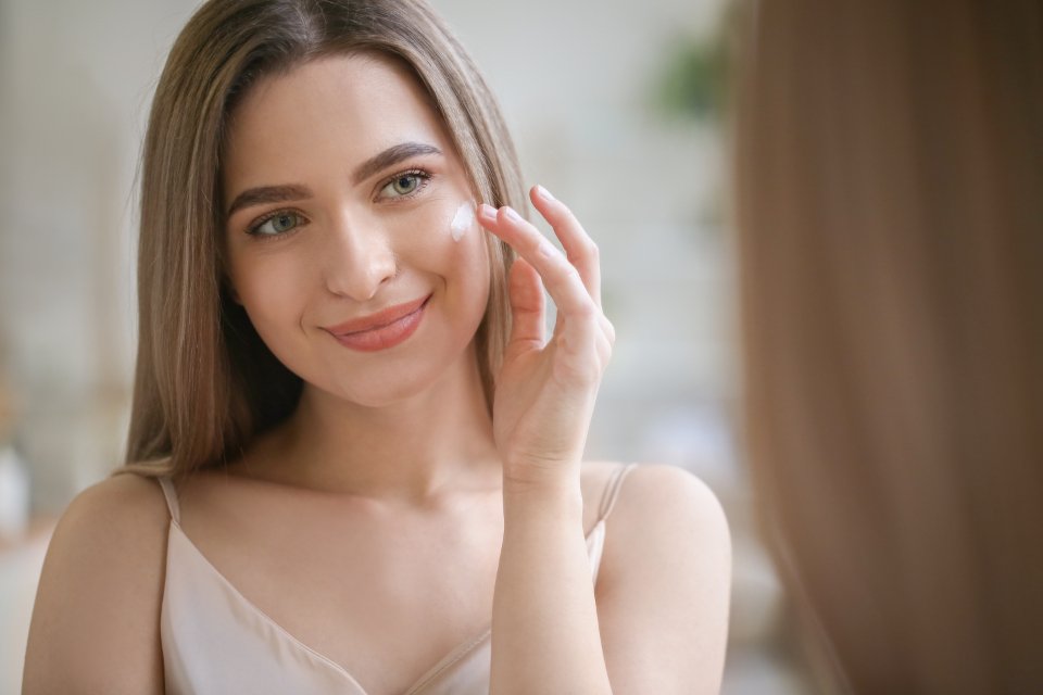 Luxury face serums applied with a glass dropper