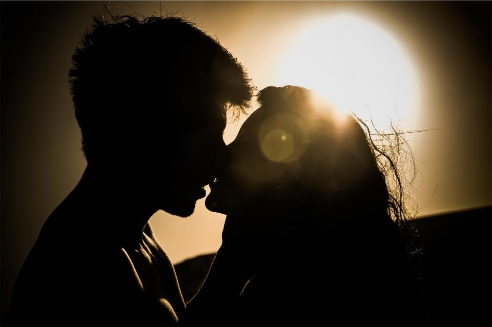 Couple silhouetted at sunset illustrating Scorpio compatibility