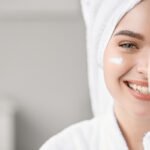 Skincare lover smiling towel