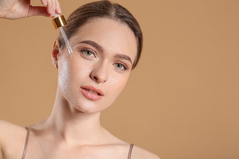 Applying serum as part of a skincare routine