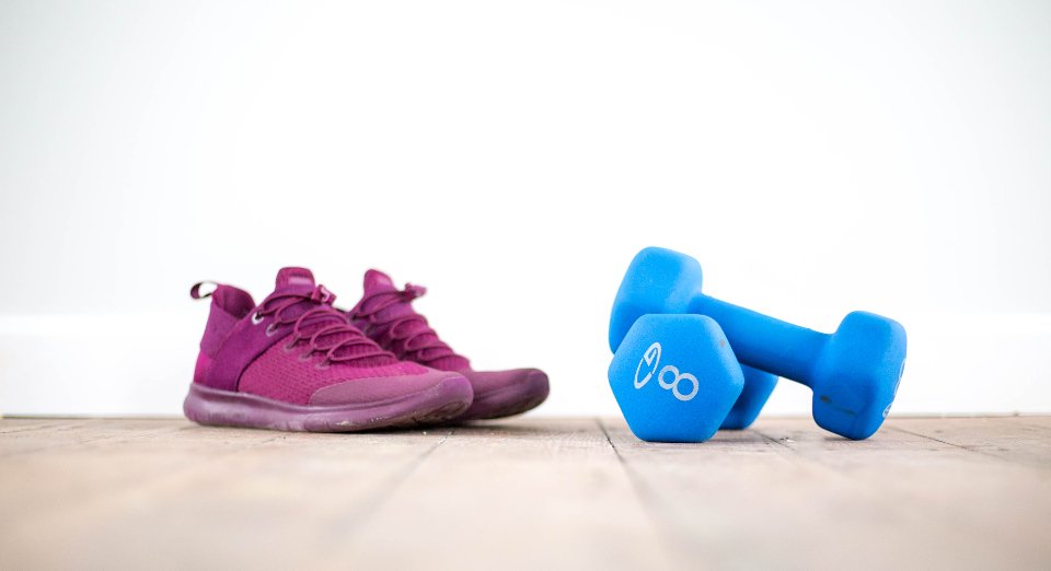 Sneakers and blue dumbbells