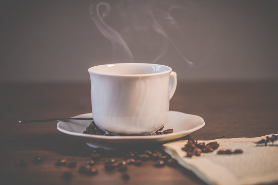 Electric kettles make a steaming cup of tea on a saucer