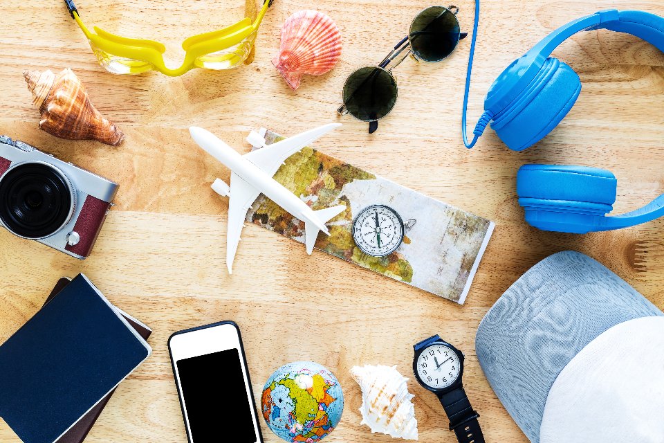 Best travel accessories for women laid out before a trip
