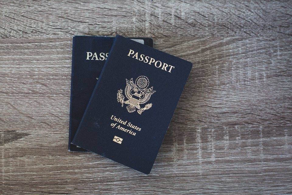Passports ready to pack with travel accessories