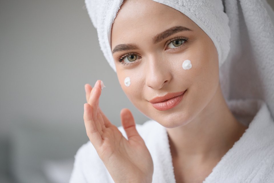 Woman enjoying a luxury hand cream and skincare routine