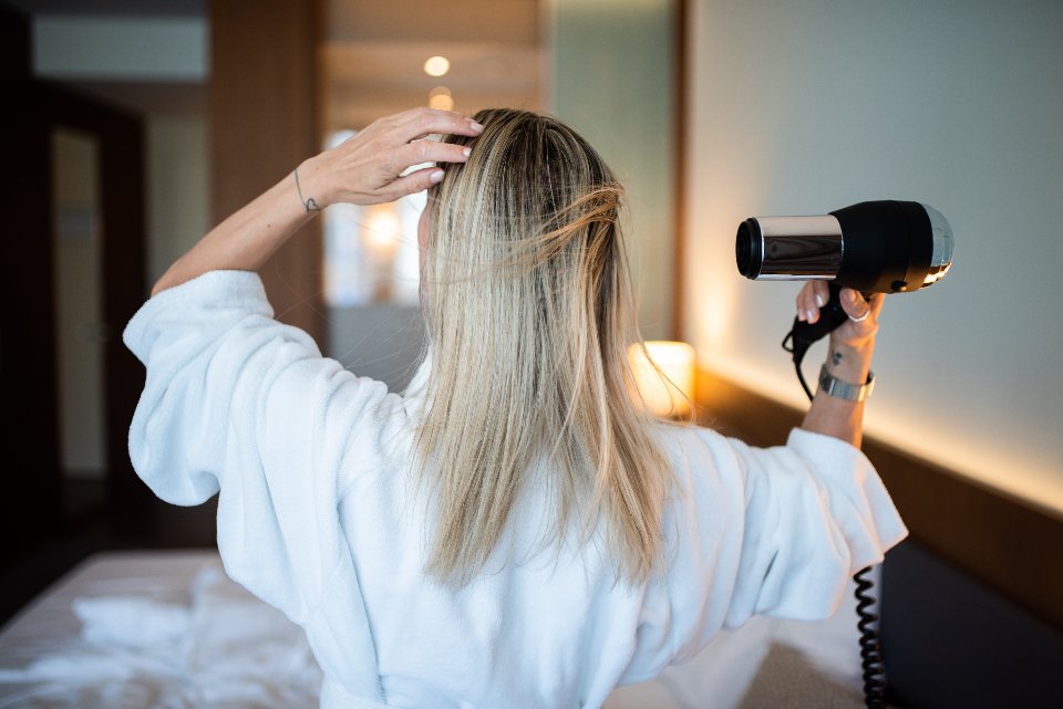 Drying hair before using a curling iron